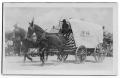 Postcard: [Covered wagon in parade]