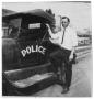 Photograph: [Port Arthur Police Patrol Car with J. C. Enrighs, Sr.]