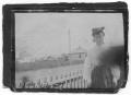 Photograph: [Woman Standing by Fence]