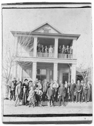 Primary view of object titled '[Large Group in Front of Boarding House]'.
