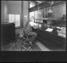 Thumbnail image of item number 1 in: '[Southern Pine Lumber Company Office Worker at Accounts Desk]'.