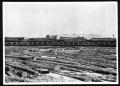 Photograph: [Full Mill Pond and Loaded Rail Cars]