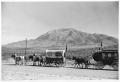 Photograph: Texas Sesquicentennial Wagon Train Passing Through Sierra Blanca
