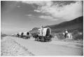 Photograph: Texas Sesquicentennial Wagon Train Passing Through Sierra Blanca
