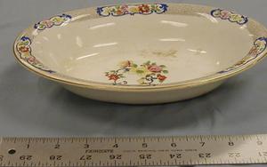 Primary view of object titled '[John Maddock and Sons Royal Vitreous oval shaped serving bowl with gold rim]'.