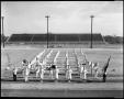 Photograph: [Denton Teacher's College marching band poses on football field]