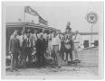 Photograph: [Photograph of Men in Front of a Texaco Station in Port Arthur, Texas…