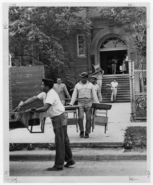 Primary view of object titled '[Maintenance men move desks in Bellaire]'.