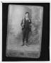 Photograph: [Photograph of a young boy in a suit]