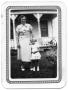 Photograph: [Mother and Young Daughter Standing on a Lawn Outside of a House]
