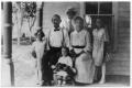 Photograph: [Berndt Family Sitting on a Porch]