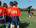 Photograph: [Boys engage in soccer drills]