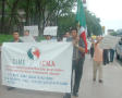 Primary view of [Protesters carry banners, signs, and a Mexican Flag]