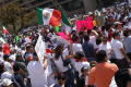 Photograph: [Protesters wave Mexican flags and signs outside Dallas City Hall]
