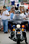 Photograph: [Close-up view of police officer on motorcycle]