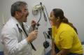 Photograph: [Dr. Henry Lenk gives a medical examination]
