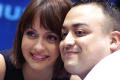 Primary view of [Gabriela has her photo taken with fan]