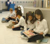 Primary view of [Students read to one another at Seminary Hills Elementary]