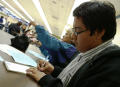 Photograph: [Taking notes during a school meeting in Fort Worth, Texas]