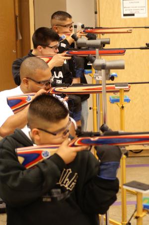 Primary view of object titled '[Air Rifle Team members practice for a tournament]'.