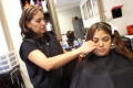 Photograph: [Woman receiving haircut]