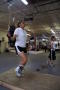 Photograph: [Young woman and boy jumping rope in boxing gym]