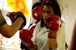 Primary view of object titled '[Girl in red boxing gloves]'.
