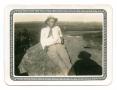Photograph: [Photograph of a Man Leaning on a Rock]