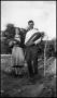 Photograph: [Photograph of a Man and Woman with Produce]