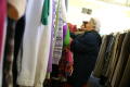 Photograph: [Two women look at the clothing at the Dallas Catholic Charities]