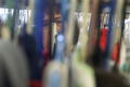 Photograph: [Individual viewed through racks of clothing at a Dallas chariy]