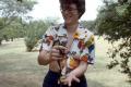 Photograph: [Mary Cresson holding frog, Emily Fowler Library staff]