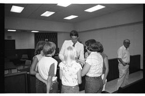 Primary view of object titled '[Charles Wilson Speaks with Constituents in 1980]'.