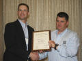 Photograph: [Chris Thibodeaux accepts award at the 2012 annual meeting banquet]