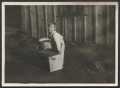 Photograph: [Unidentified Boy With Crate and Washtub]
