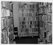 Photograph: [Bookshelves Inside Helen Hall Library]