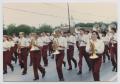 Photograph: [High School Marching Band in a Parade]