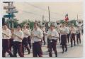 Photograph: [Marching Band in a Parade]