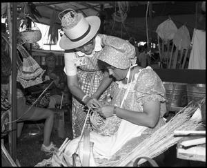 Primary view of object titled '[Virginia Monroe Weaving a Basket]'.