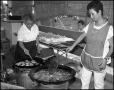 Photograph: [Two Women Preparing Wontons in Chinese Booth]