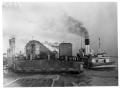 Photograph: [Ferry Barge and Passenger Train in New Orleans]
