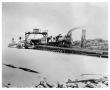 Photograph: [Ferry Barge and Passenger Train in New Orleans]