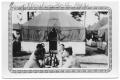 Photograph: Soldiers at table outside tent 1942