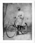Photograph: [Caroline McGuire Street, posing on a bicycle]