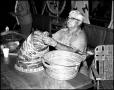 Photograph: [J. O. McKnight  Making Baskets]