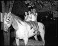 Photograph: [Children Sitting on Replica Horse]