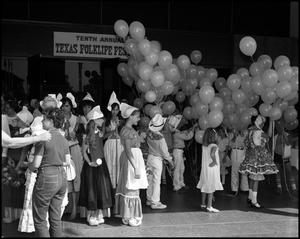 Primary view of object titled '[Children Holding Balloons at the Opening Ceremony]'.