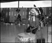 Photograph: [Indian Man Chanting and Playing a Drum]
