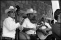 Photograph: [Lone Star Fiddlers Playing on the Porch of Frontier Fort]