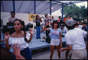 Primary view of object titled '[Visitors Dancing to Tejano Music]'.